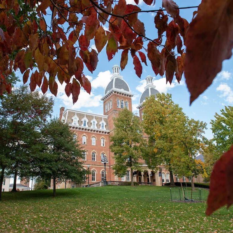 The front lawn of W&J's Old Main building during fall.